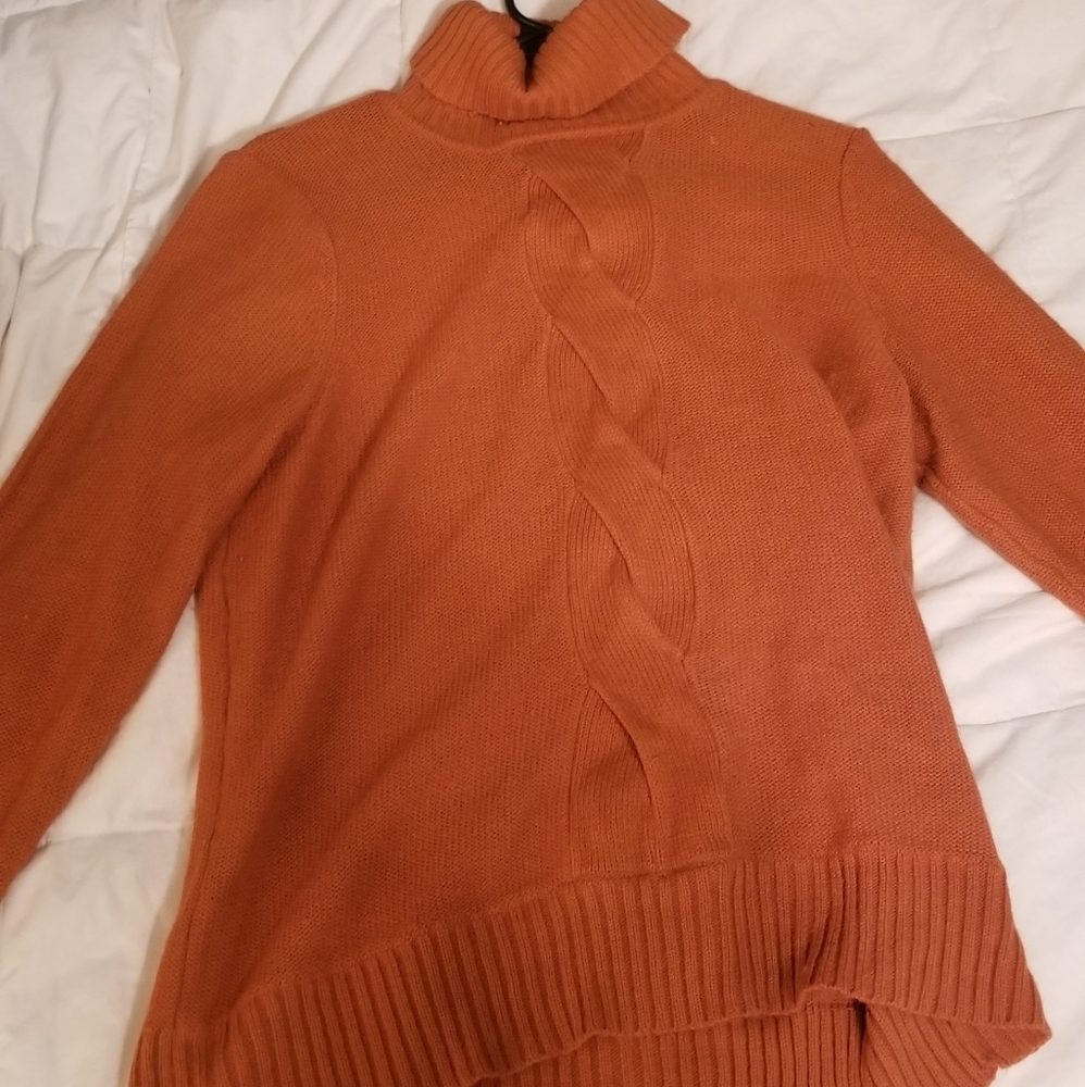 Orange knit turtleneck sweater